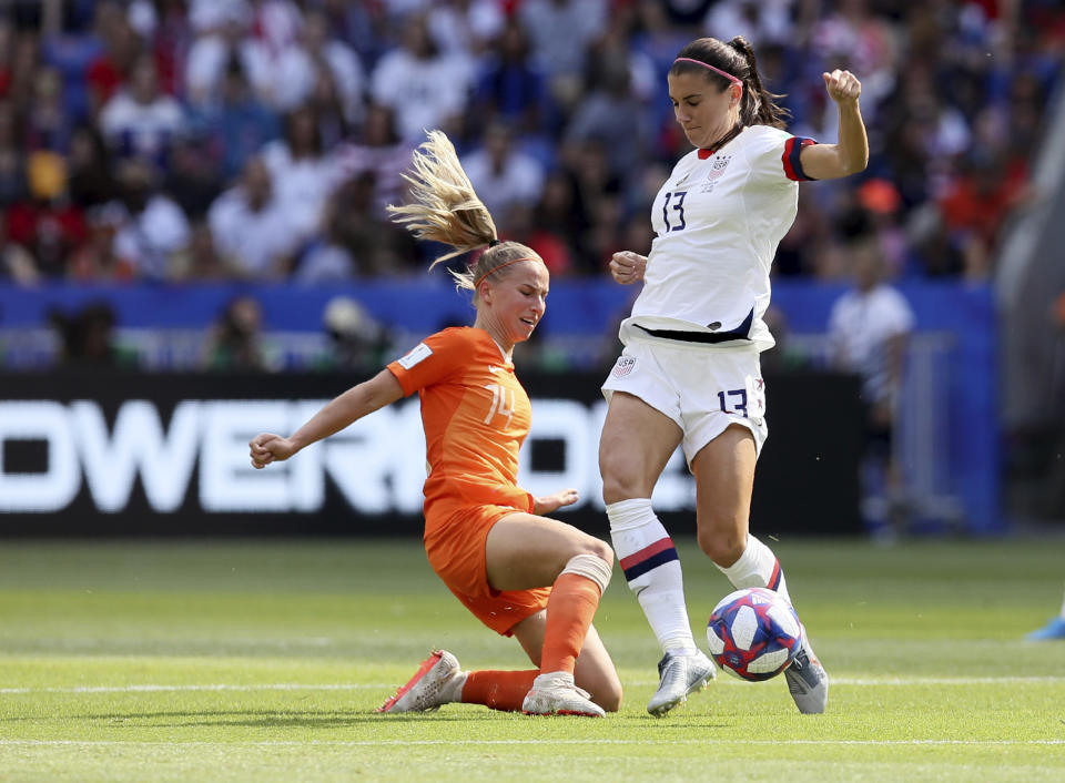 United States' Alex Morgan, right, is challenged by Netherlands' Jackie Groenen during the Women's World Cup final soccer match between US and The Netherlands at the Stade de Lyon in Decines, outside Lyon, France, Sunday, July 7, 2019. (AP Photo/David Vincent)