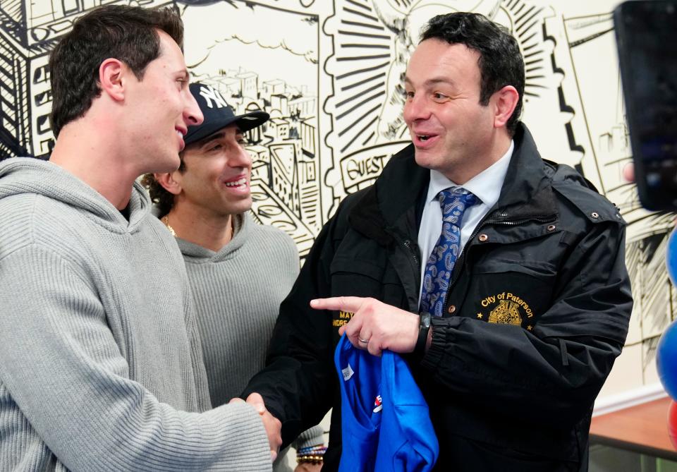 Paterson Mayor, Andre Sayegh (right), meets New York Giants quarterback, Tommy DeVito (left) and agent, Sean Stellato,Tuesday, January 2, 2024.