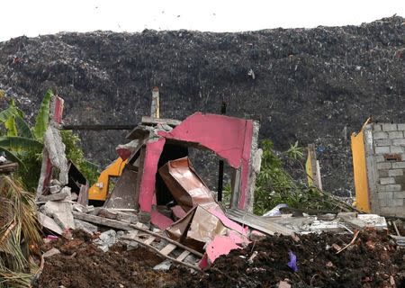 A damaged house is seen during a rescue mission after a garabage dump collapsed and buried dozens of houses in Colombo, Sri Lanka April 15, 2017. REUTERS/Dinuka Liyanawatte