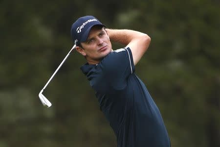 Justin Rose of England watches his tee shot on the 10th hole during the first round of the U.S. Open Championship golf tournament in Pinehurst, North Carolina, June 12, 2014. REUTERS/Mike Segar