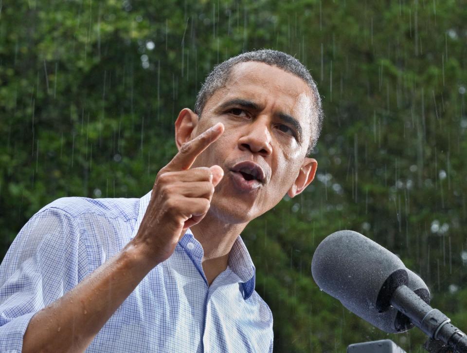 President Barack Obama campaigns despite the pouring rain at the historic Walkerton Tavern & Gardens in Glen Allen, Va., near Richmond, Saturday, July 14, 2012. It is in the Congressional district represented by Republican House Majority Leader Eric Cantor, R-Va., a key county in a crucial swing state of the presidential election. (AP Photo/J. Scott Applewhite)