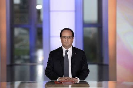 French President Francois Hollande is seen before appearing on France 2 television prime time live programme "Dialogues Citoyens" (Citizen's Dialogue) for an interview at the Musee de l'Homme in Paris, France, April 14, 2016. REUTERS/Stephane de Sakutin/Pool