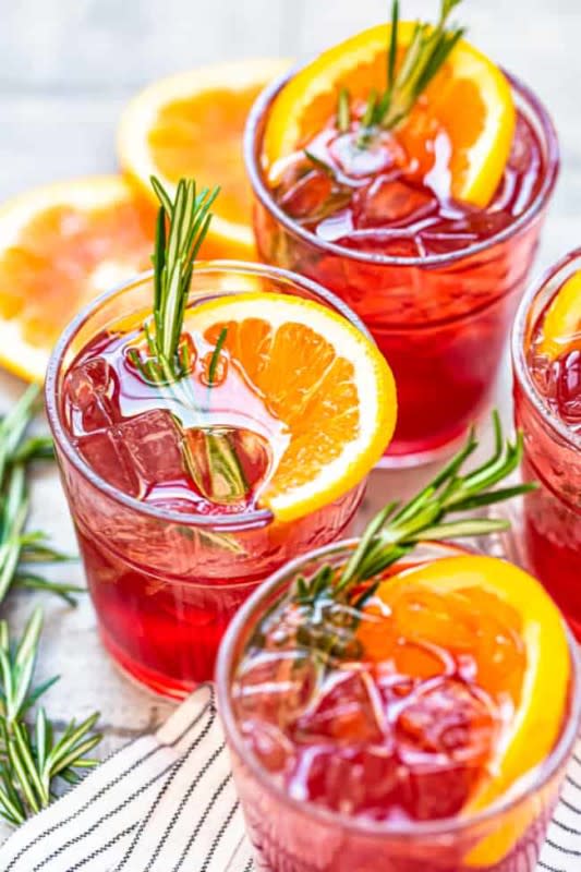 <p>The Cookie Rookie</p><p>Easy and quick to make, Thanksgiving calls for a warming drink filled with flavors of tart cranberry and zesty orange.</p><p><strong>Get the recipe: <a href="https://www.thecookierookie.com/orange-cranberry-bourbon-smash/" rel="nofollow noopener" target="_blank" data-ylk="slk:Orange Cranberry Bourbon Smash;elm:context_link;itc:0;sec:content-canvas" class="link rapid-noclick-resp">Orange Cranberry Bourbon Smash</a></strong></p>