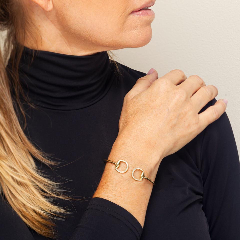 <p><a href="https://totiequestrian.com/products/connection-bangle-in-yellow-gold-with-diamonds" rel="nofollow noopener" target="_blank" data-ylk="slk:Shop Now;elm:context_link;itc:0;sec:content-canvas" class="link ">Shop Now</a></p><p>Connection Bangle</p><p>totiequestrian.com</p><p>$4090.00</p>