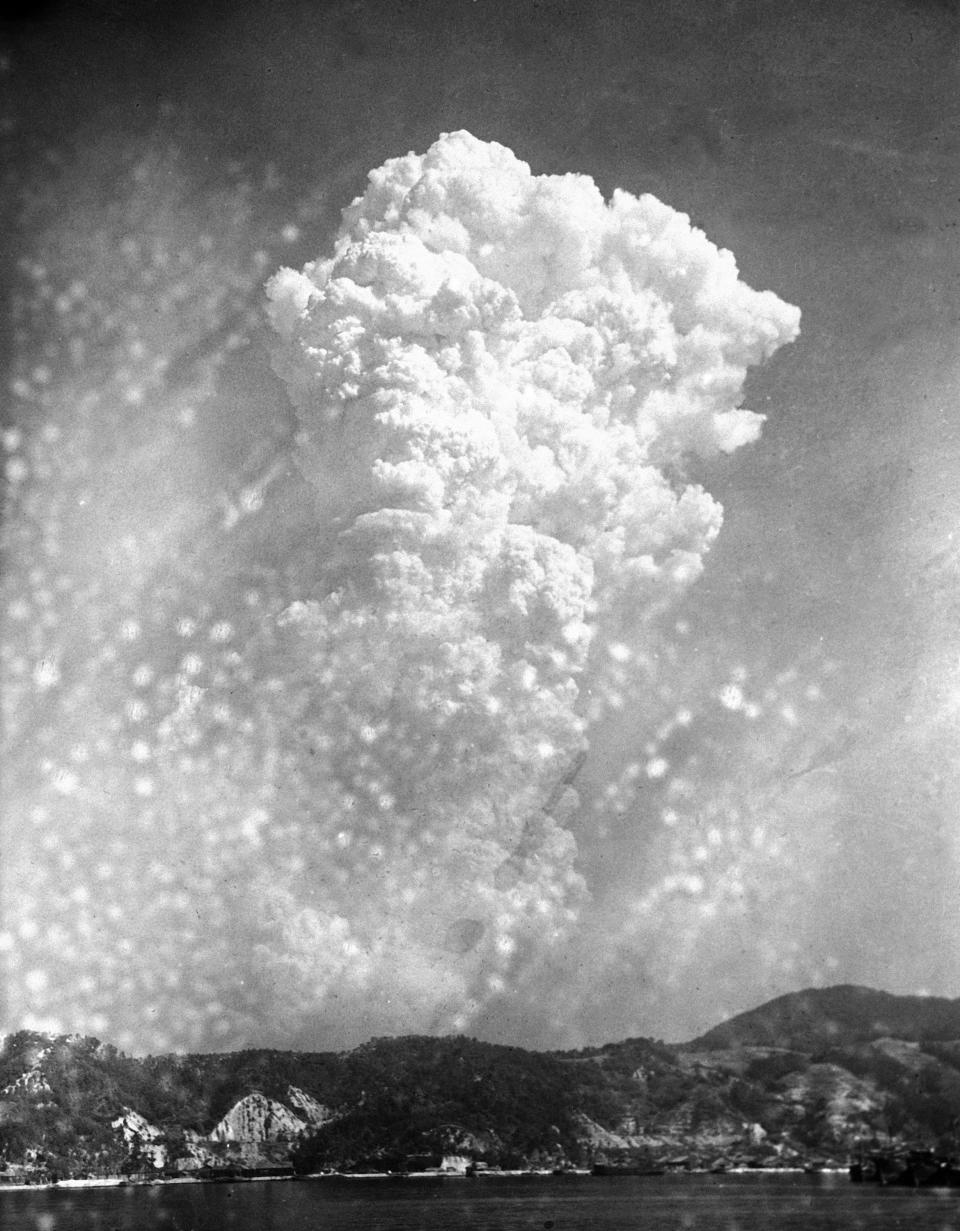 FILE - In this Aug. 6, 1945, file photo, smoke rises 20,000 feet above Hiroshima, western Japan, after the first atomic bomb was dropped during warfare. Hiroshima was targeted because it was a major Japanese military hub filled with military bases and ammunition facilities. The city of Hiroshima on Thursday, Aug. 6, 2020 marks the 75th anniversary of the world’s first nuclear attack. (AP Photo, File)