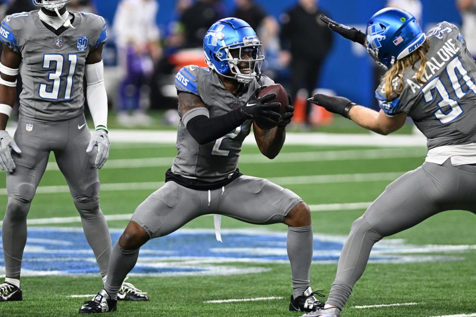 Detroit Lions safety C.J. Gardner-Johnson (2) and linebacker Alex Anzalone (34) celebrate after Gardner-Johnson intercepted a pass late in the fourth quarter vs. the Minnesota Vikings at Ford Field, Jan. 7, 2024.