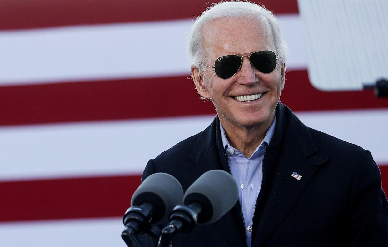 President-elect Joe Biden jokingly thanks Georgia for certifying his victory three times as he campaigns on behalf of Democratic Senate candidates Jon Ossoff and Raphael Warnock in Atlanta on Monday. (Photo: Jonathan Ernst / Reuters)