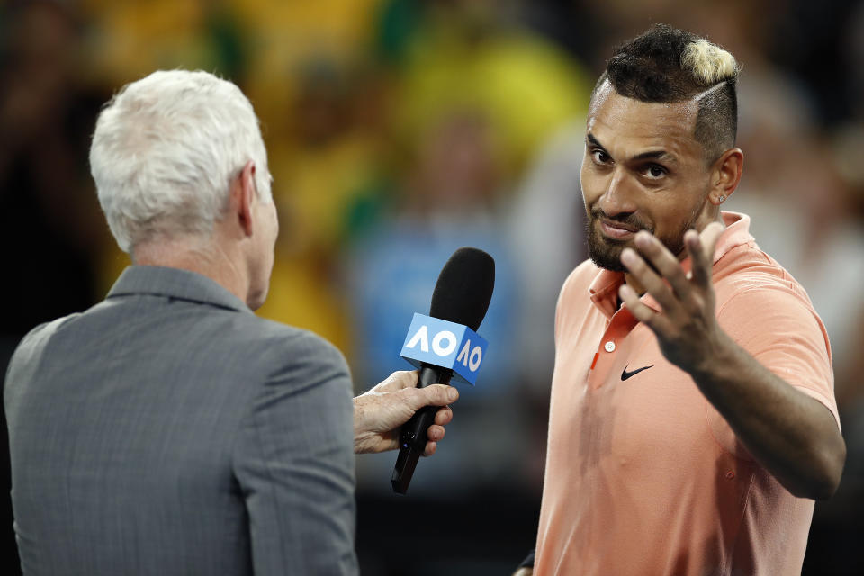 Seen on the left, John McEnroe interviews Nick Kyrgios at the Australian Open in 2022.