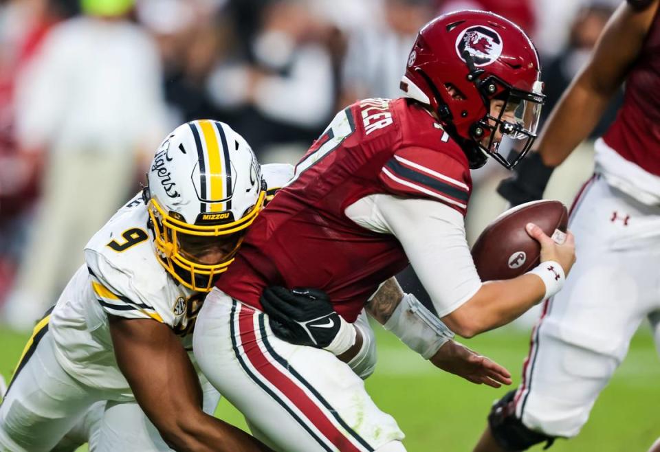 South Carolina Gamecocks quarterback Spencer Rattler (7) is sacked by Missouri Tigers defensive lineman Isaiah McGuire (9) in the second half at Williams-Brice Stadium in Columbia, South Carolina, on Oct. 29, 2022.