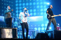 <p>Chester Bennington, Dave “Phoenix” Farrell and Mike Shinoda of Linkin Park peform on stage at the Tokyo leg of the Live Earth series of concerts, at Makuhari Messe, Chiba on July 7, 2007 in Tokyo, Japan. Launched by former US Vice President Al Gore to combat Global Warming, the concert is one of a series taking place over a 24-hour period on July 7 across seven continents. (Photo: Koichi Kamoshida/Getty Images) </p>