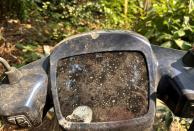 An Ola electric scooter's screen is seen outside the Ola Electric Service Centre, in Thane on the outskirts of Mumbai