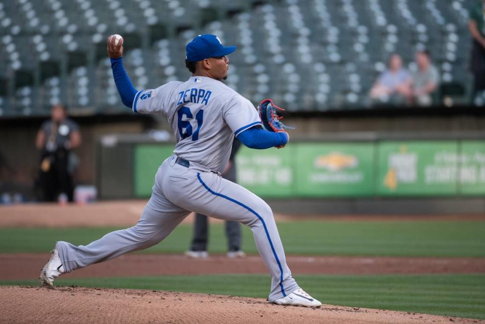 Kansas City Royals pitcher Angel Zerpa (61) throws a pitch during the first inning against the Athletics in a barren Oakland-Alameda County Coliseum.