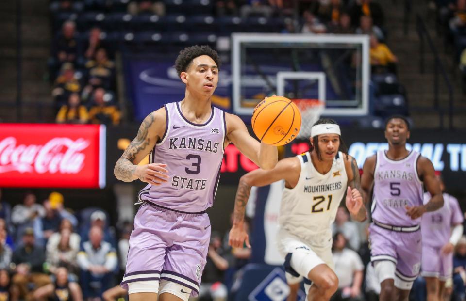 Kansas State guard Dorian Finister (3) leads a fast break against West Virginia on Jan. 9 in Morgantown West Virginia. Finister, a redshirt freshman, is entering the transfer portal after two seasons with the Wildcats.