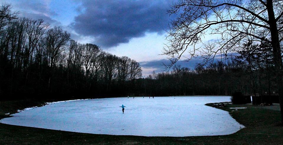 Cold evenings create a perfect setting for skaters on the ice pond at Sand Run Metro Park Big Bend Area.