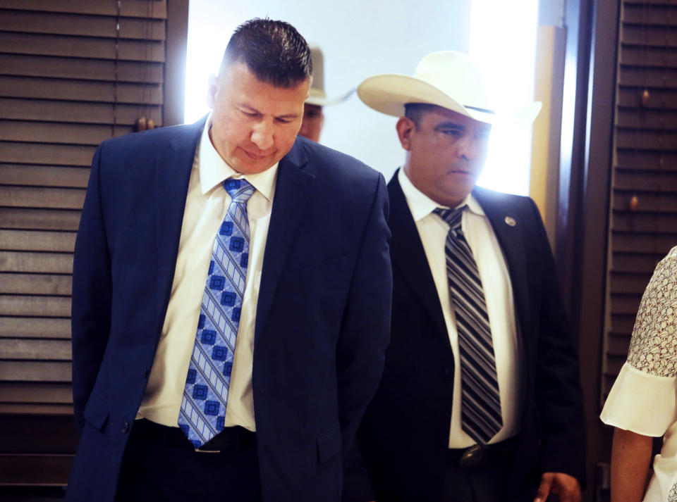 CORRECTS BYLINE TO JOEL MARTINEZ - Edinburg Mayor Richard Molina walks into the courtroom before being arraigned by Justice of the Peace Precinct 2 Jaime "Jerry" Muñoz on charges of trying to rig his own 2017 election victory, Thursday, April 25, 2019, in Pharr, Texas. (Joel Martinez/The Monitor via AP)