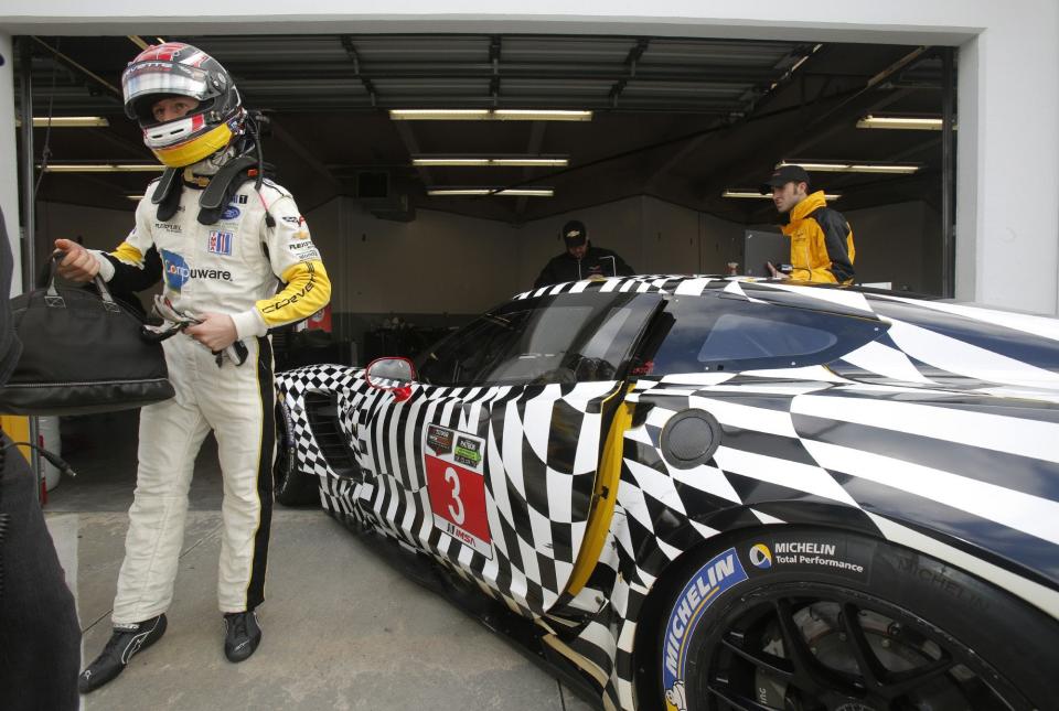 Driver Jan Magnussen prepares to take the No. 3 Corvette on track during IMSA testing at the Roar Before The Rolex at Daytona International Speedway, Friday, January 3, 2014.