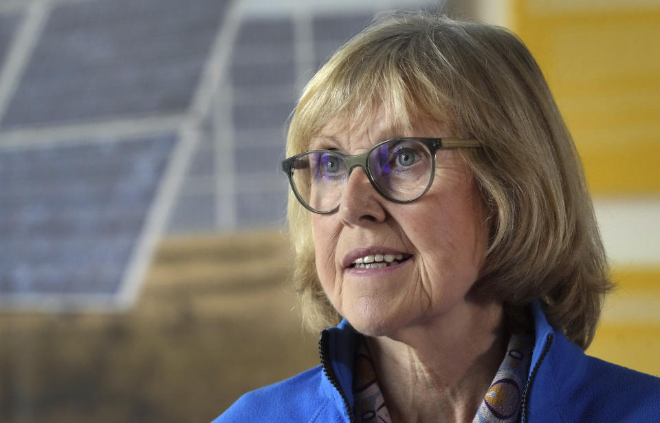 Kathleen Thompson, who works for a local educational organization, speaks during an interview with the Associated Press in Feldheim near Treuenbrietzen, Germany, Wednesday, Sept. 28, 2022. Located about an hour and a half south of Berlin, the village of Feldheim has been energy self-sufficient for more than a decade. (AP Photo/Michael Sohn)