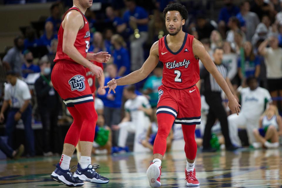 Liberty Flames guard Darius McGhee (2) reacts after making a 3-pointer during the ASUN men’s basketball game between FGCU and Liberty, Saturday, Jan. 15, 2022, at Alico Arena in Fort Myers, Fla.Liberty defeated FGCU 78-75.
