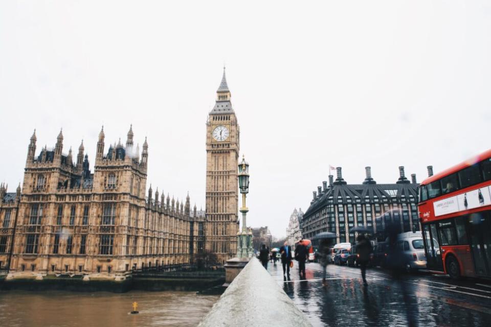 people walking on sidewalk near Big Ben in London