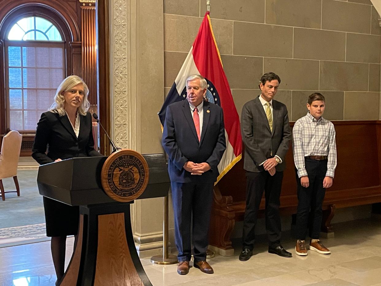Ginger Gooch was appointed to the Missouri Supreme Court on October 30, 2023 in front of the Governor's Office in the Missouri State Capitol building in Jefferson City, MO. From left to right are Ginger Gooch, Gov. Mike Parson, Gooch's husband, Chad, and their son Edward.
