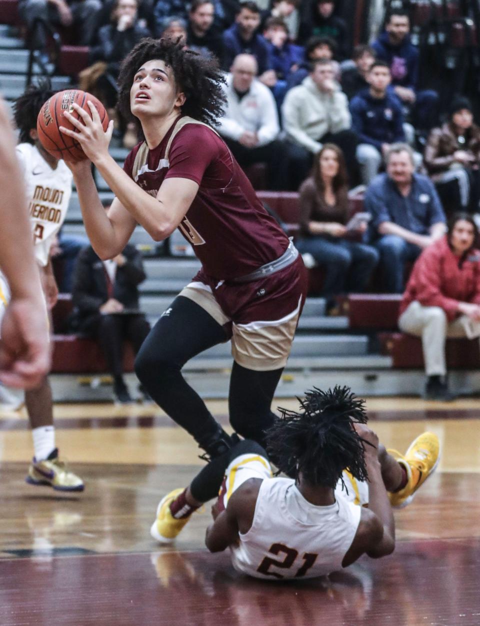 AJ Rodriguez of Iona Prep shoots over Dylan Colon of Mount Vernon during a varsity basketball game at Mount Vernon High School Feb. 5, 2023. Iona prep defeated Mount Vernon 85-79 in overtime. 