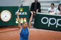 Estonia's Kaia Kanepi celebrates winning against Spain's Garbine Muguruza in three sets, 2-6, 6-3, 6-4, in their first round match at the French Open tennis tournament in Roland Garros stadium in Paris, France, Sunday, May 22, 2022. (AP Photo/Thibault Camus)