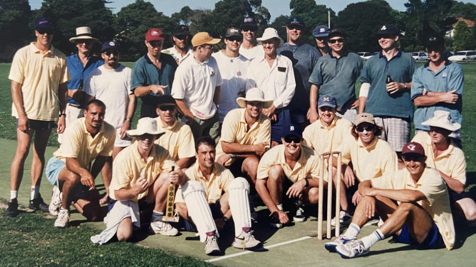 A group of men with cricket gear.