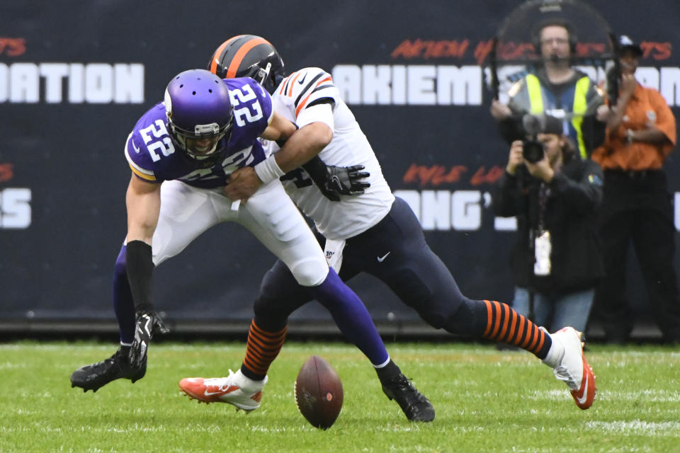 Minnesota Vikings free safety Harrison Smith reaches for a fumble as Chicago Bears quarterback Chase Daniel defends during the half of an NFL football game Sunday, Sept. 29, 2019, in Chicago. The Bears recovered the fumble. (AP Photo/Matt Marton)