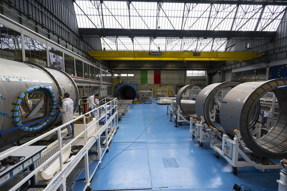Components for NASA's HALO, or Habitation and Logistics Outpost (left), and ESA's I-Hab, or International Habitat, are seen under construction at Thales Alenia Space in Turin, Italy, in November 2023.