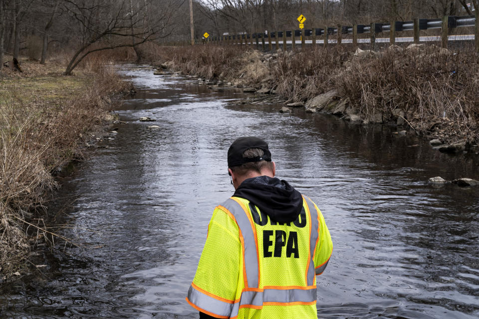 An EPA Emergency Response worker checks for chemicals that have settled at the bottom of a creek in East Palestine, Ohio (Michael Swensen / Getty Images file)
