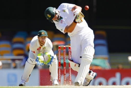 South African batsman Jacques Kallis drives Nathan Lyon of South Africa for six runs on day five of their first Test at the Gabba. South Africa staved off Australia's push for an unlikely victory to bat out for a draw in the first Test on Tuesday