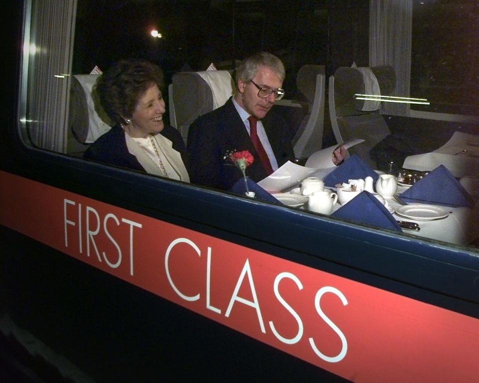 British Prime Minister John Major and his wife Norma on a train at King's Cross Station