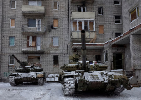 Tanks are seen in the government-held industrial town of Avdiyivka, Ukraine. REUTERS/Gleb Garanich