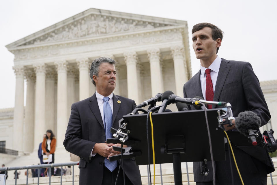 FILE - Alabama Solicitor General Edmund LaCour, right, speaks alongside Alabama Attorney General Steve Marshall following oral arguments in Merrill v. Milligan, an Alabama redistricting case, outside the Supreme Court on Capitol Hill in Washington, Oct. 4, 2022. The Supreme Court on Thursday, June 8, 2023, issued a surprising ruling in favor of Black voters in a congressional redistricting case, ordering the creation of a second district with a large Black population. (AP Photo/Patrick Semansky, File)