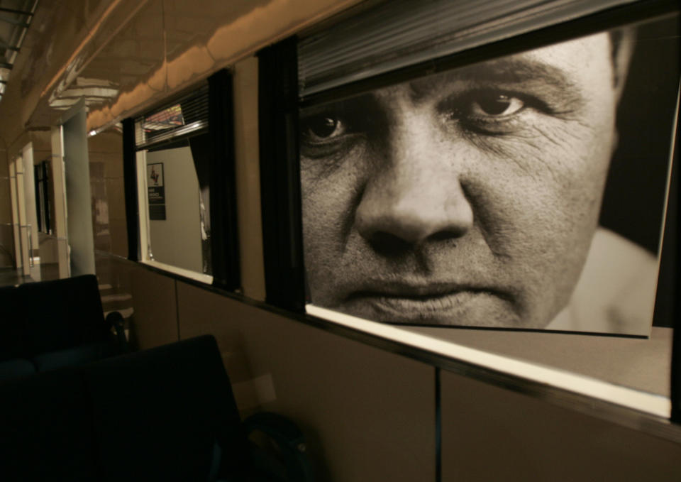 FILE - This May 13, 2005 file photo shows a large photograph of Babe Ruth used for an exhibit at the Sports Legends at Camden Yards museum in Baltimore. There are many destinations of interest to baseball fans around the country outside ballparks from museums and statues to historic homes. (AP Photo/Chris Gardner, File)