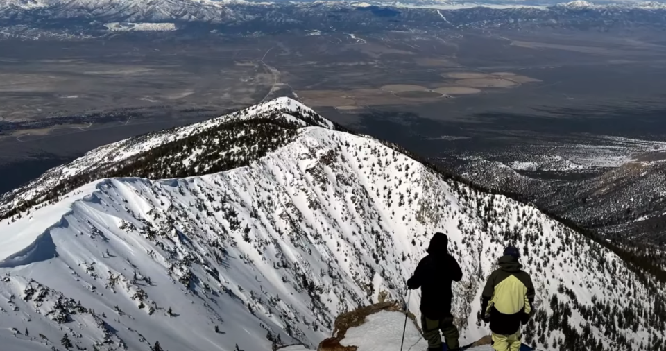 Josh Daiek and Trevor Semmens scope out their line from an adjacent ridge.<p>YouTube/Josh Daiek</p>