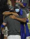 Los Angeles Dodgers third baseman Justin Turner hugs relief pitcher Kenley Jansen after defeating the Tampa Bay Rays 3-1 to win the baseball World Series in Game 6 Tuesday, Oct. 27, 2020, in Arlington, Texas. (AP Photo/Tony Gutierrez)