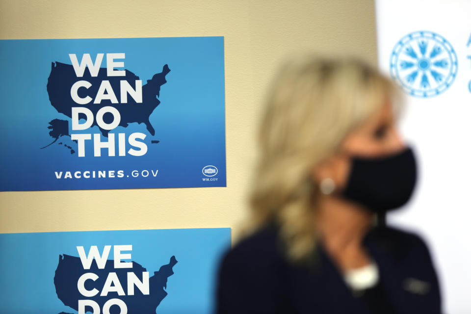 First lady Jill Biden approaches a stage area to address the media during a visit, Wednesday, July 21, 2021, to the Alaska Native Health Tribal Health Consortium office in Anchorage, Alaska. Biden stopped in Alaska's largest city as she traveled to Tokyo, her first solo international trip as first lady, leading a U.S. delegation to the Olympic Games. (AP Photo/Mark Thiessen)