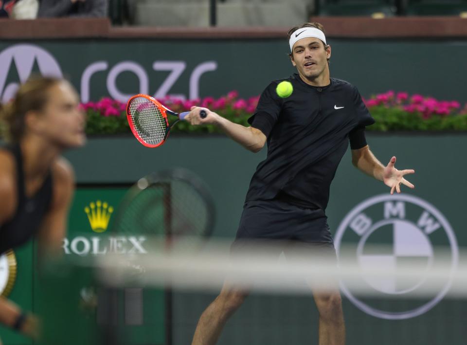 Taylor Fritz and Arnya Sabalenka play in the Tie Break Tens event in the Eisenhower Cup in Indian Wells, Calif., March 7, 2023. 