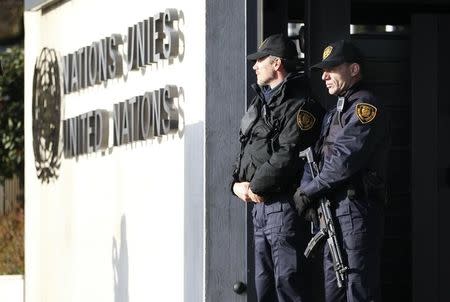 United Nations security officers stand guard outside the U.N. European headquarters in Geneva, Switzerland, December 10, 2015. REUTERS/Pierre Albouy