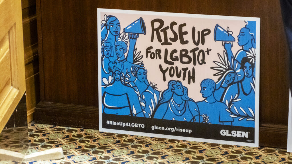 A sign supporting LGBTQ+ kids appears in the office of House Democratic leadership on March 5, 2024, at the Statehouse in Topeka.