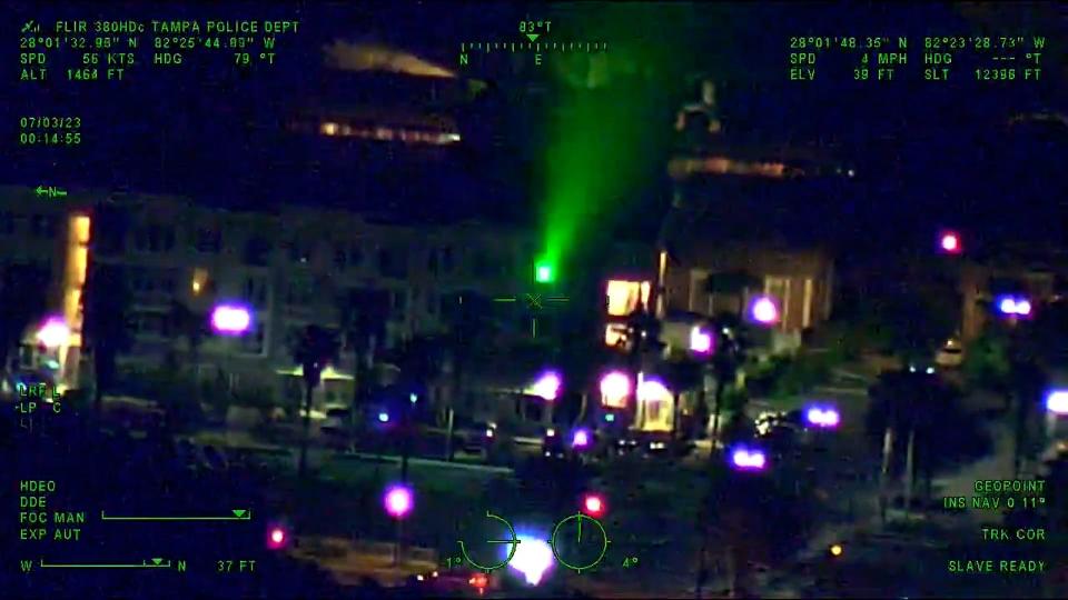 Tampa police arrested a 26-year-old man who they say shined a green laser at a police helicopter on Monday