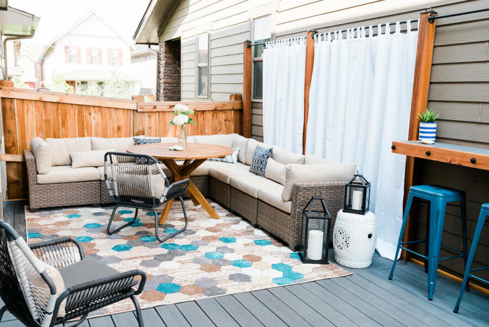 A colorful rug ties together an outdoor lounge