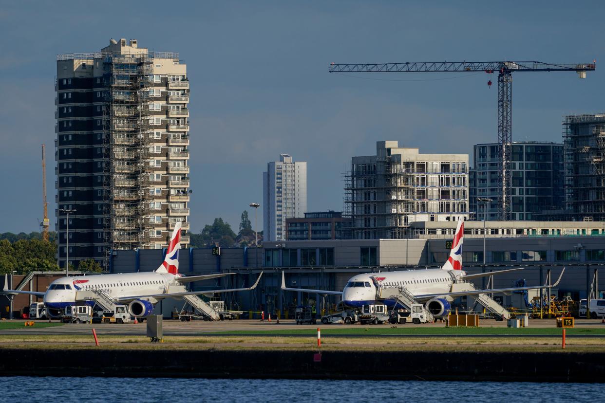 Airplanes are grounded at London City Airport, in London, Monday, Aug. 28, 2023. Britain's air traffic control system says it is experiencing a 
