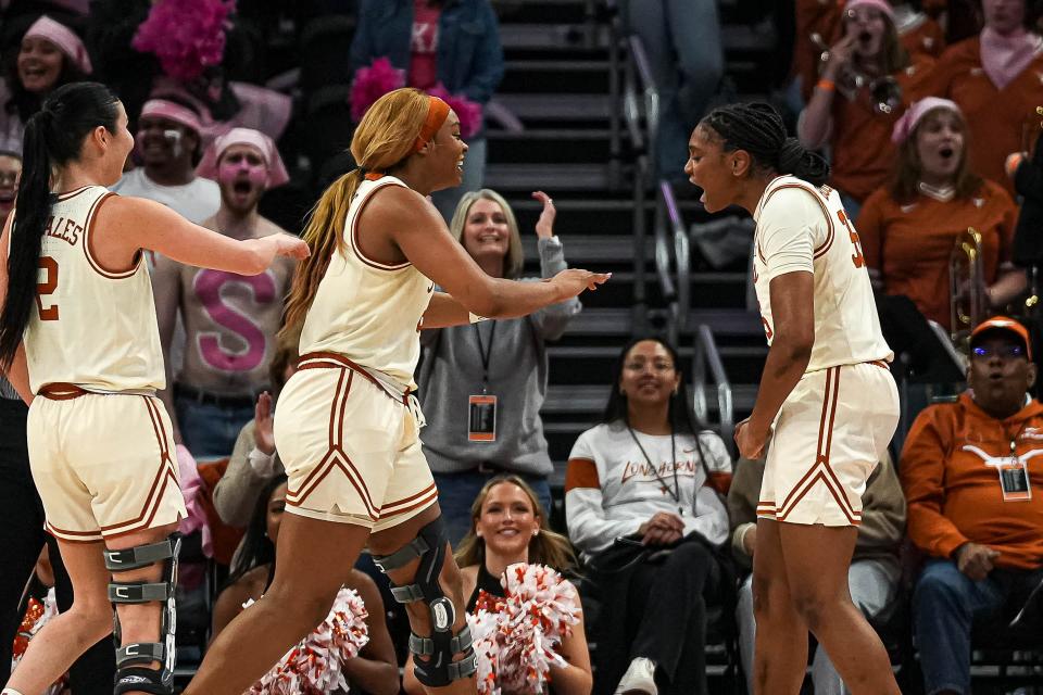 Texas guard Madison Booker, right, and forward Aaliyah Moore, left, celebrate a blocked shot during the Longhorns' win over Iowa State on Feb. 17 at Moody Center. The Longhorns, seeded No. 1 in the NCAA Tournament, face 16th-seeded Drexel on Friday afternoon.
