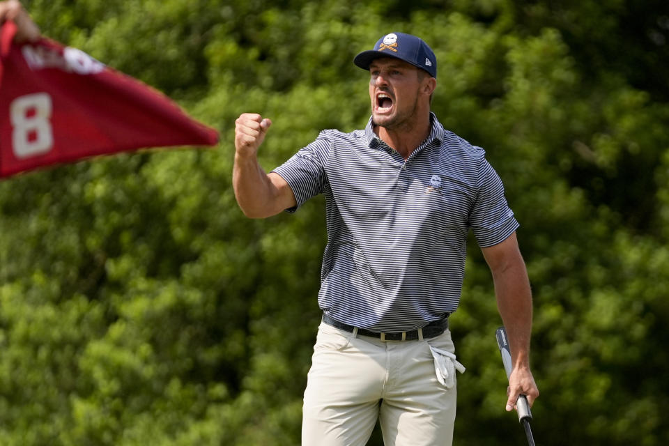 Bryson DeChambeau celebrates after a putt on the eighth hole during the final round of the U.S. Open golf tournament Sunday, June 16, 2024, in Pinehurst, N.C. (AP Photo/Frank Franklin II)