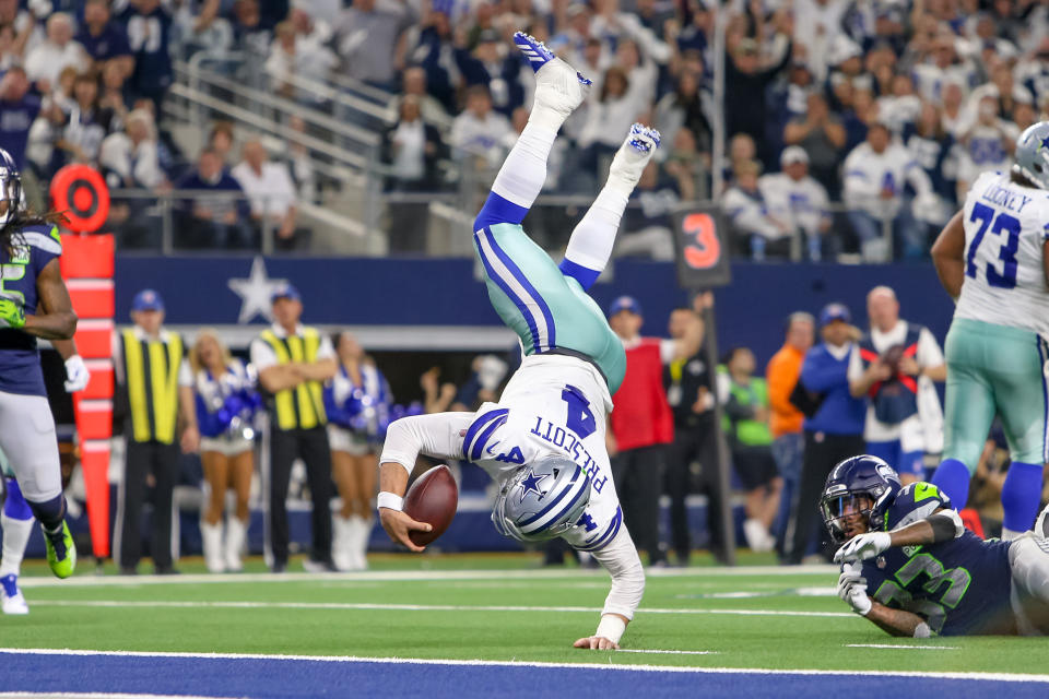 <p>Dallas Cowboys quarterback Dak Prescott (4) dives for the end zone during the NFC wildcard playoff game between the Seattle Seahawks and Dallas Cowboys on January 5, 2019 at AT&T Stadium in Arlington, TX. (Photo by Andrew Dieb/Icon Sportswire) </p>