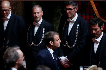 French President Emmanuel Macron arrives at the Versailles Palace's hemicycle to address both the upper and lower houses of the French parliament at a special session in Versailles, near Paris, France July 9, 2018. Thibault Camus/Pool via REUTERS