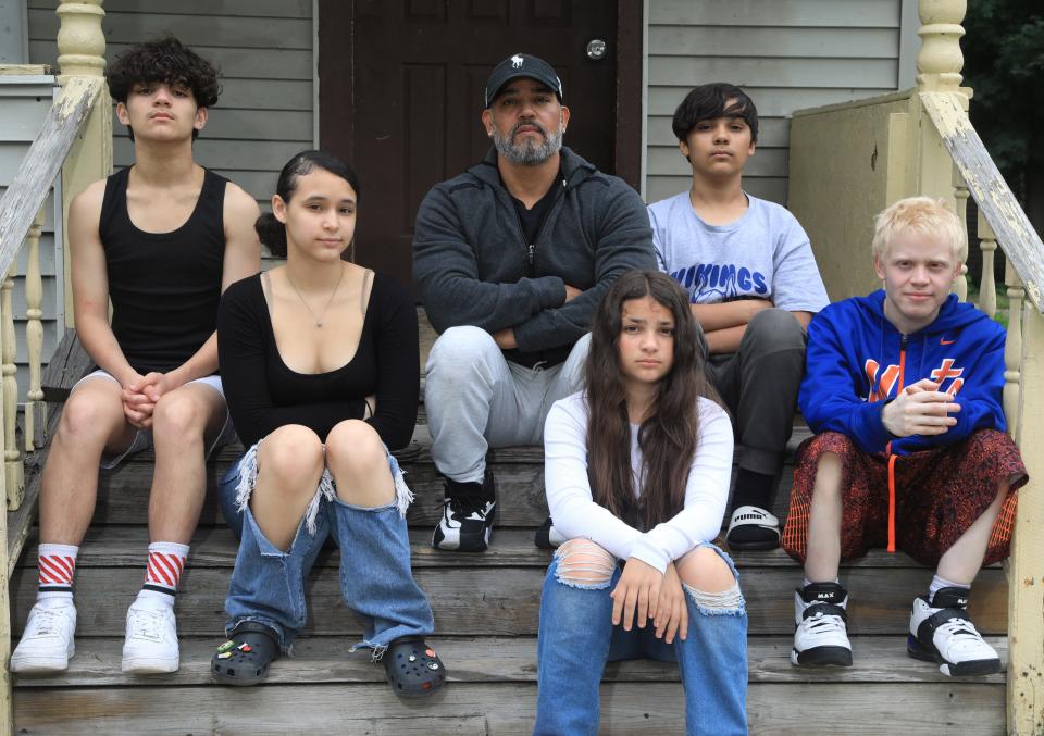 Eric Alvarez with his family outside their home in Walden, N.Y. on June 21, 2022.