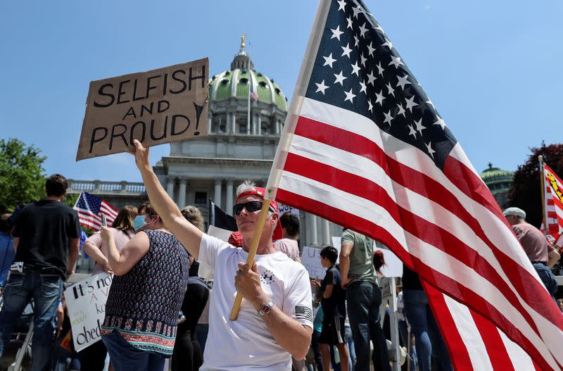 Trump supporters and others rally against coronavirus disease restrictions at the Pennsylvania Capitol in Harrisburg